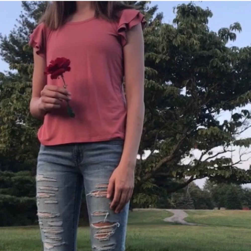Pink top with ruffled sleeves, brand new.